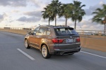 2013 BMW X5 xDrive35i in Sparkling Bronze Metallic - Driving Rear Left View